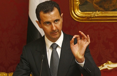 Syrian President Bashar al-Assad gives a