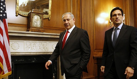 Israel's PM Netanyahu walks next to House Majority Leader Cantor before pre-bipartisan meeting on Capitol Hill in Washington