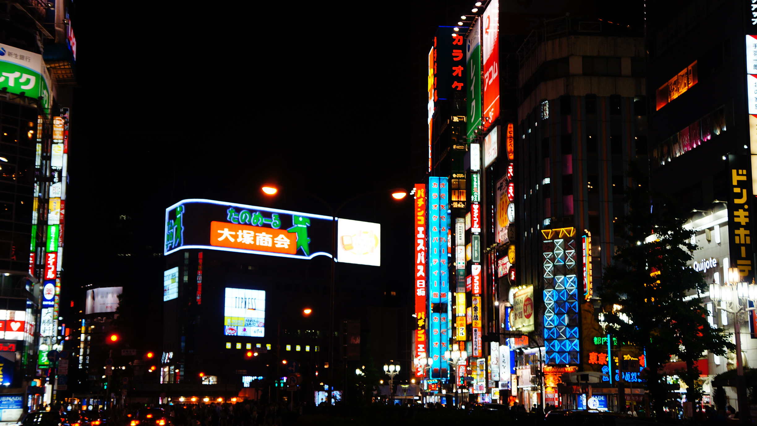 Tokyo's Shinjuku neighborhood at nighttime. 